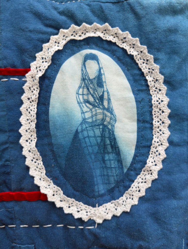 Detail of embroidered quilt, using cyanotype and re-used textiles and trimmings. Featuring illustrations of Lois's female ancestry.