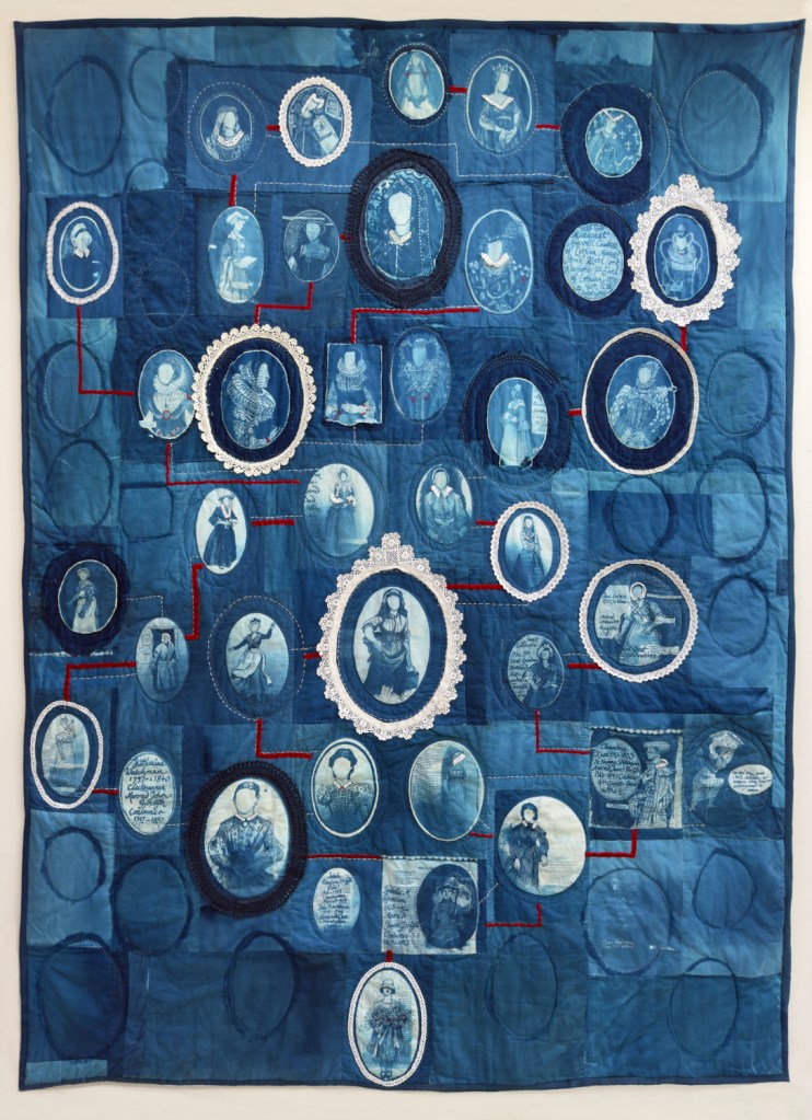 A embroidered quilt, using cyanotype and re-used textiles and trimmings. Featuring illustrations of Lois's female ancestry.